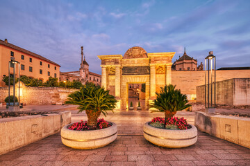 Illuminated Mezquita Cathedral and Roman Bridge in Cordoba at Sunset, Andalusia