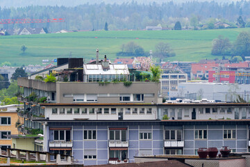 Obraz premium Scenic view of roof terrace at Swiss City of Zürich on a cloudy spring day. Photo taken April 15th, 2025, Zurich Schwamendingen, Switzerland.