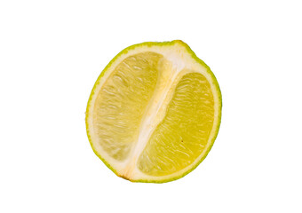 One half of a juicy lime, macro, isolated on a white background.
