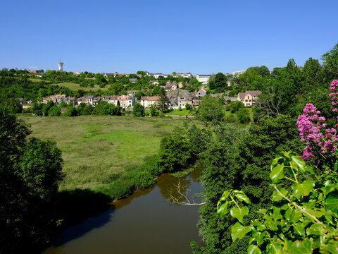 Aerial view of Fresnay on Sarthe and its river and red valerian flowers. Fresnay sur Sarthe is a commune in the Sarthe department in the region of Pays de la Loire in north-western France  