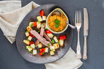 Lamb with smoky pepper sauce and saute potatoes