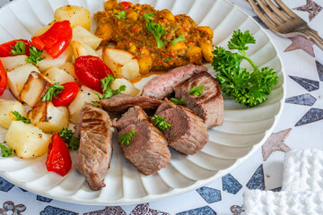 Lamb with smoky pepper sauce and saute potatoes