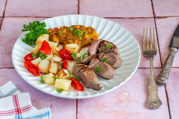 Lamb with smoky pepper sauce and saute potatoes