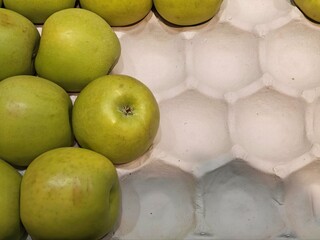 Box of apples in the supermarket.