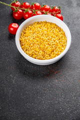 Macaroni pasta raw coquillette appetizer dish organic product fresh tasty gourmet food background on the table rustic food top view copy space