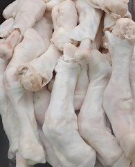 Juicy meat. Lamb's trotters at the supermarket. 