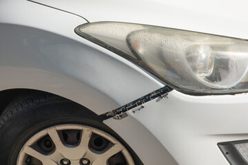 Car bumper was roughly reattached using visible screws. broken headlights, scratches, dents, and...