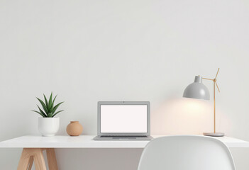 White desk with closed laptop and decorative plant