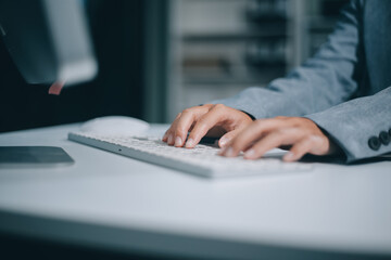 Portrait of Asian young female working on laptop at office