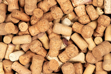 Close-up of various natural wine and champagne corks. A textured background of used cork stoppers, eco-friendly and sustainable material for crafts or recycling projects.