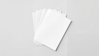 Minimalistic stack of blank white sheets on neutral surface, clean design