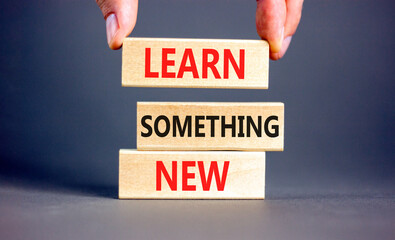 Learn something new symbol. Concept words Learn something new on beautiful block. Businessman's...