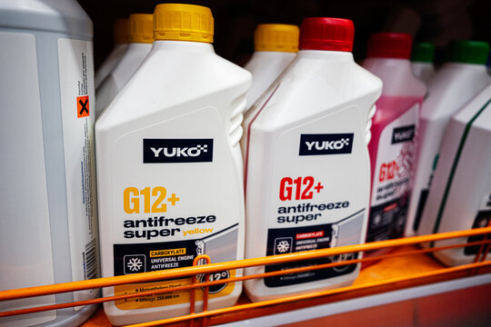 Bottles of G12 antifreeze coolant displayed on a commercial retail shelf