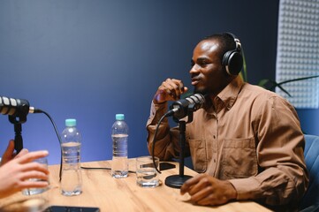 Handsome African American podcast host. Record a podcast or video blog