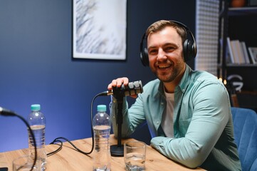 Podcast presenter having live discussion with man, streaming it for audience on internet...