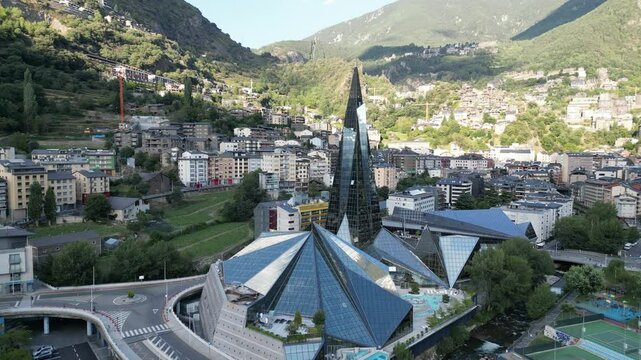 Drone view of Caldea Spa in Andorra la Vella surrounded by mountains during the day