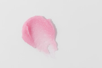 Pink sugar scrub smear smudge swatch. Natural cosmetic skin exfoliation product sample