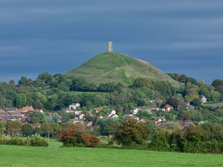 English landscape with historic Glastonbury Tor on the big hill surrounded  by trees  © romansucho 67