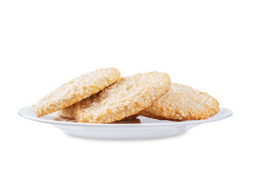 Sesame seeds cookies in a plate on a white isolated background