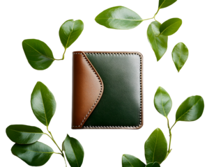 leather wallet with green leaves on white background minimalistic style fashion and accessories concept