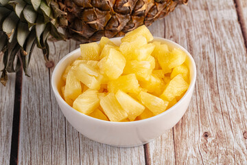 Sweet canned pineapple fruit pieces