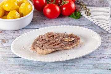 Grilled lamb steak with bone