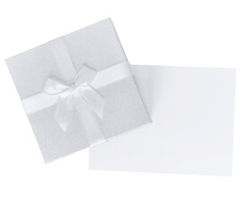 Top view of silver gift box with white ribbon and open greeting card, isolated on transparent background. Elegant festive composition with copy space.