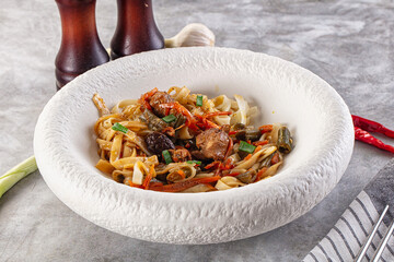 Asian cuisine udon with chicken and vegetables