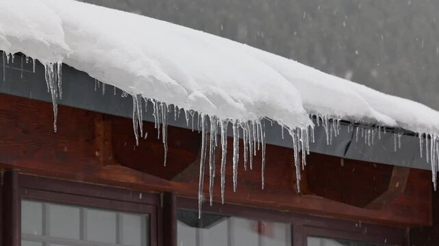 Icicles on the roof of a house in the Pyrenees, Cerler, Spain