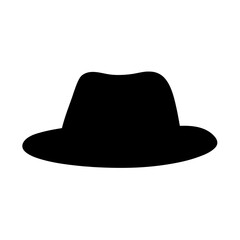 Silhouette of a classic fedora hat casting a shadow in darkness