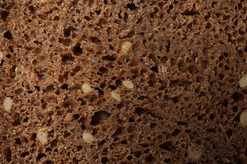 Freshly baked bread as background, closeup view