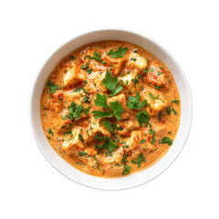 Close up of paneer butter masala in a white bowl with fresh herbs isolated on transparent background
