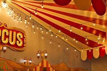 A circus sign illuminated by bulbs