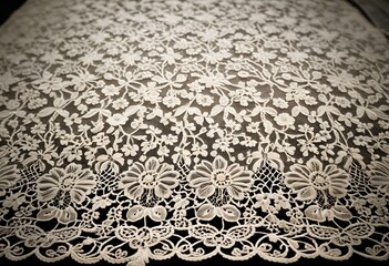 A close up of a white lace on a brown background.