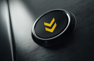 A black elevator button featuring a yellow arrow indicating an upward direction