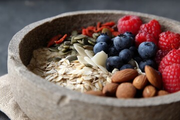 Healthy Breakfast Bowl Featuring Oatmeal, Fresh Berries, Assorted Nuts, and a Variety of Nutritious Seeds