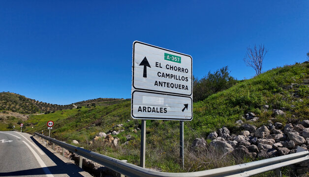 Road sign indicating El Chorro, Campillos, Antequera and Ardales in Andalusia, Spain