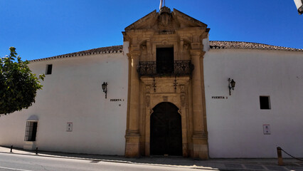 Plaza de Toros de Marbella showing its main entrance under blue sky
