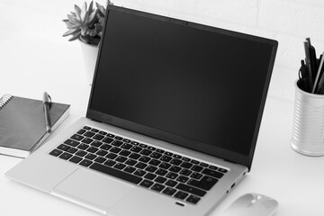 Fototapeta premium Modern Minimalist Workspace with Blank Laptop Screen for Custom Content