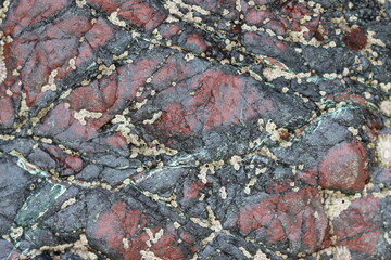 Red and green serpentine rock in Kynance Cove, Cornwall
