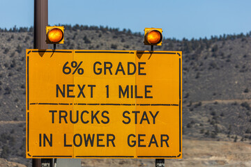 Caution ahead: A steep 6% grade descent through the mountains — truckers, shift to a lower gear...