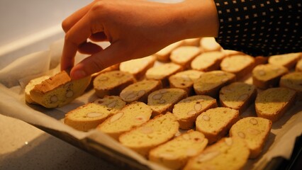Hand Of A Woman Turns Sweet Cantucci After Double Baking