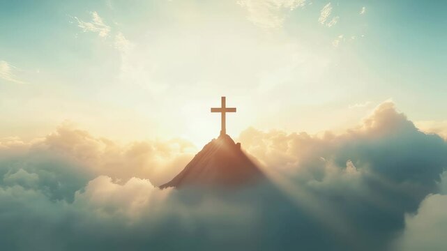 Dramatic sunrise with cross on mountain peak above the clouds
