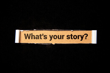 The text What's Your Story appearing behind torn brown paper.