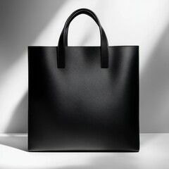 Elegant Black Leather Tote Bag: Minimalist Style in Soft Light