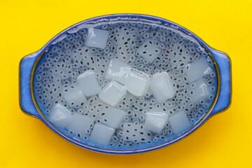 Coconut jelly with basil seeds in syrup