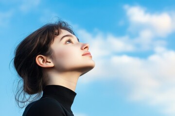 Woman gazing up at sky