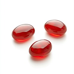 Three translucent, red oval capsules on white background