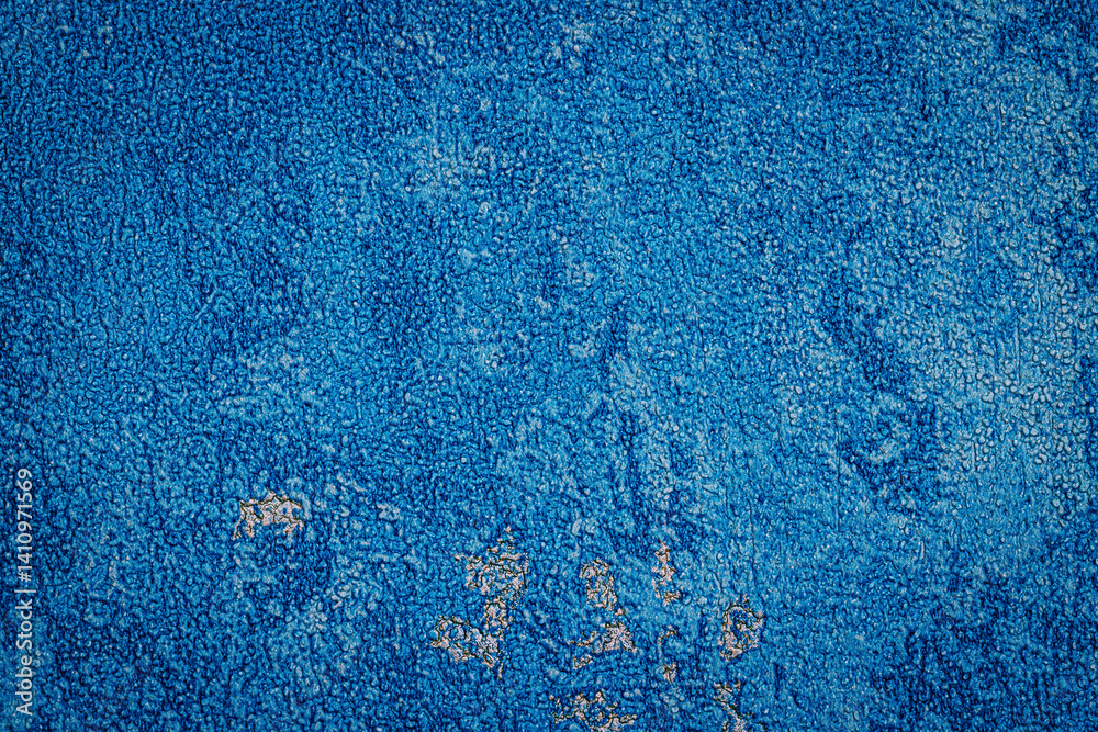 Poster Textured blue surface displays intricate patterns and varying shades, creating an eye-catching visual appeal