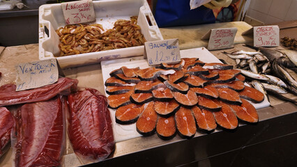 Fresh fishmonger showing salmon, tuna and prawns at Cadiz market in Spain © 4kclips
